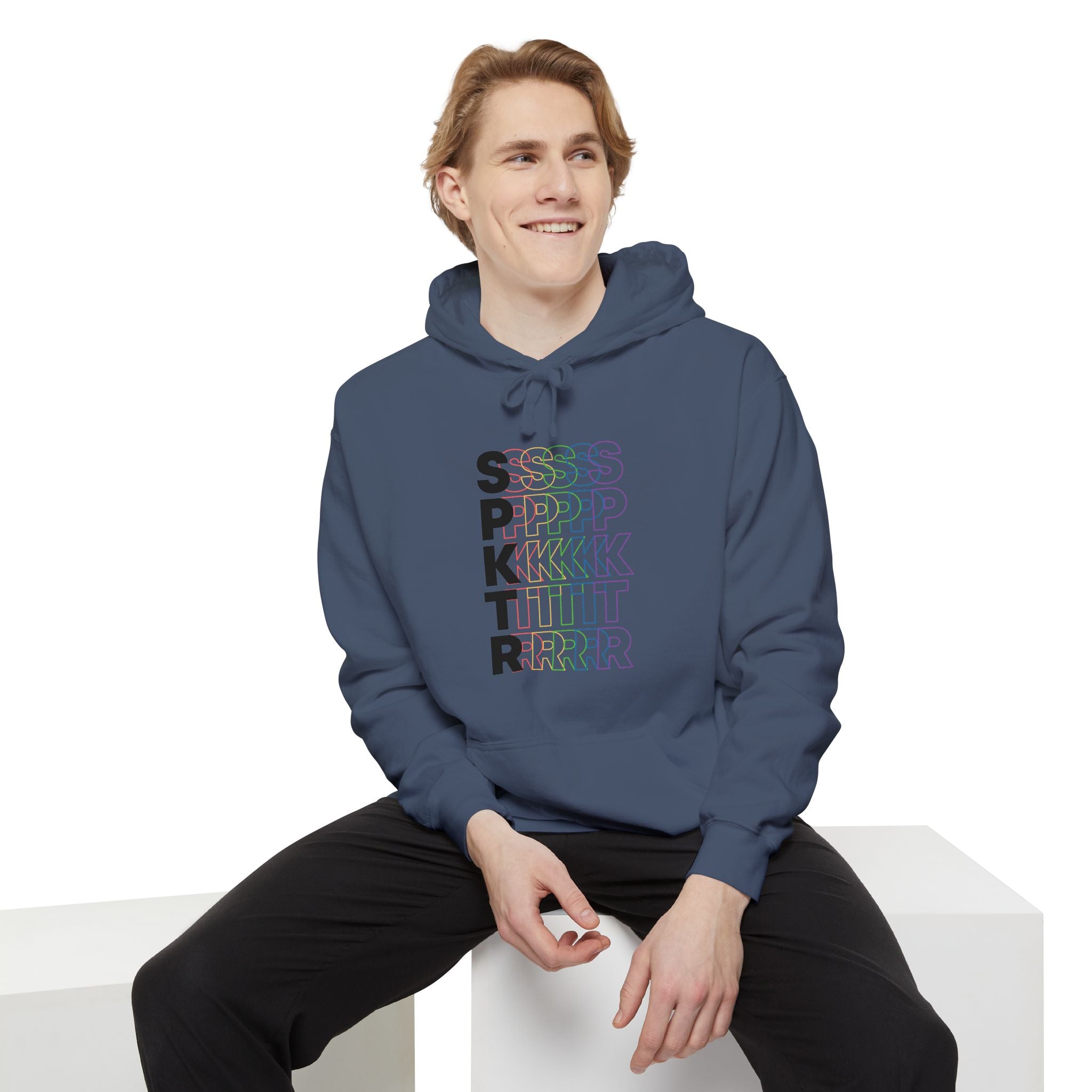 White hoodie featuring the SPKTR Pride rainbow design celebrating neurodiversity and LGBTQIA+ pride.