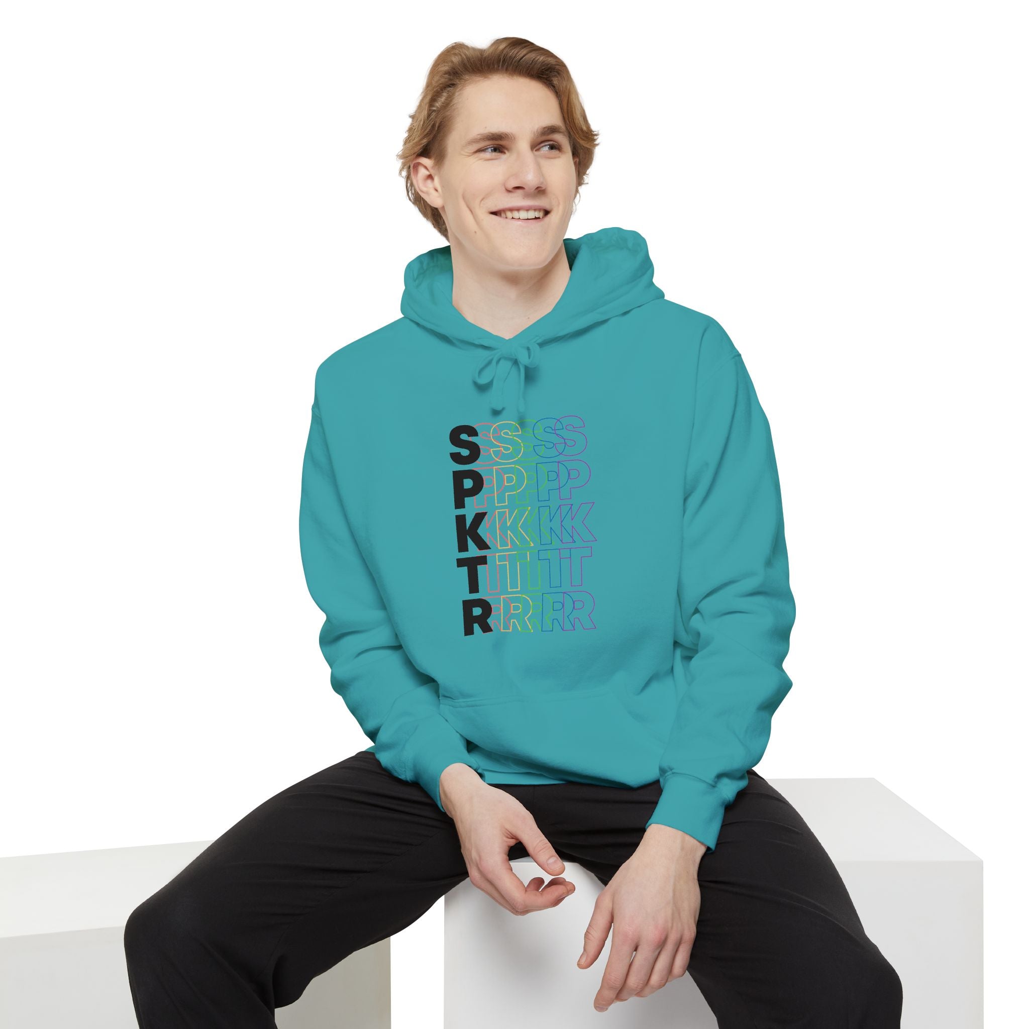 Pepper hoodie featuring the SPKTR Pride rainbow design celebrating neurodiversity and LGBTQIA+ pride.
