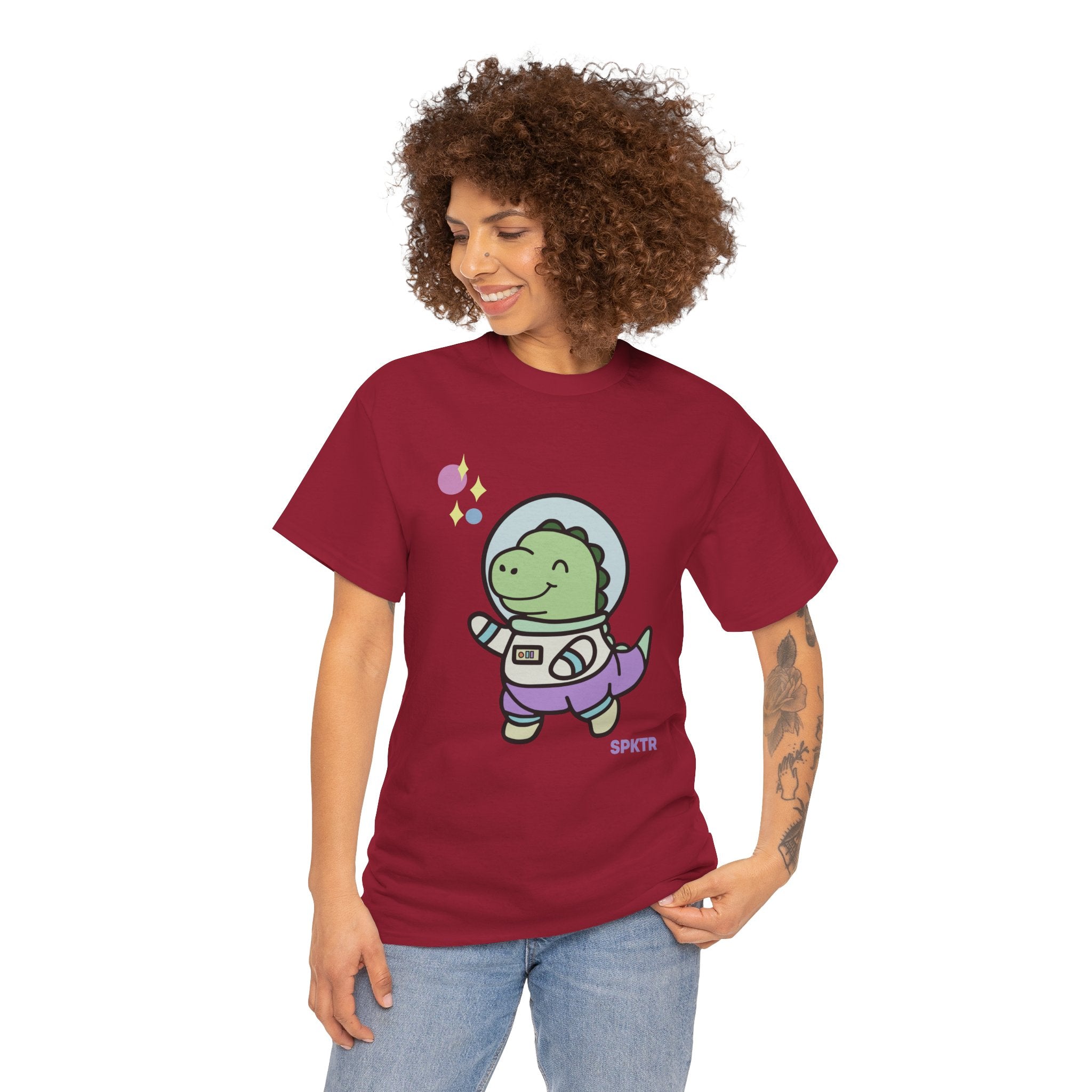 Kiwi T-shirt featuring Astronauta, a smiling Teeny-Rex dinosaur floating through space.
