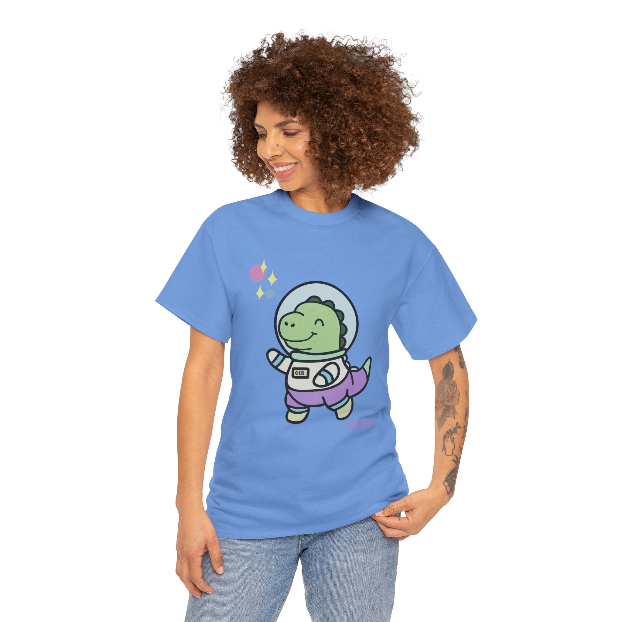 Violet T-shirt featuring Astronauta, a smiling Teeny-Rex dinosaur floating through space.