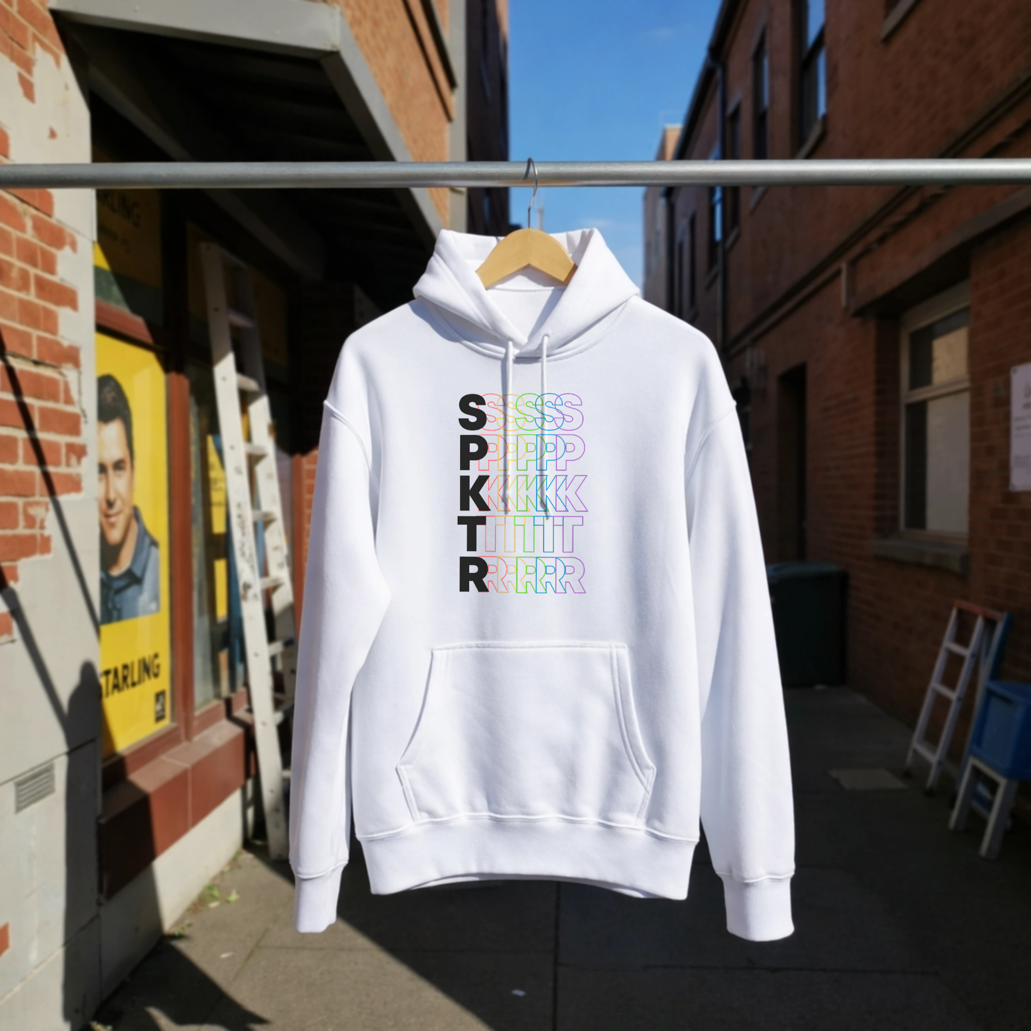 Crimson hoodie featuring the SPKTR Pride rainbow design celebrating neurodiversity and LGBTQIA+ pride.